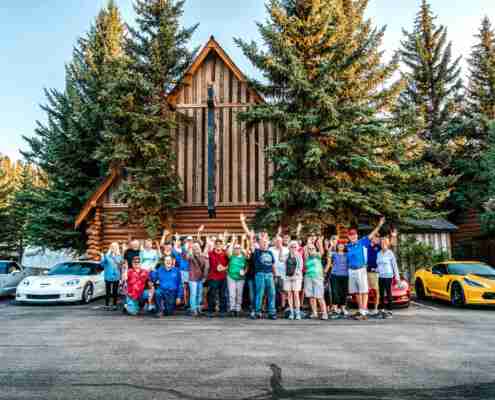 the team at the hatchet resort standing out front and waving