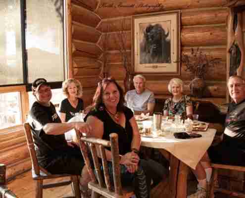 people dining and smiling at the Whetstone Grill