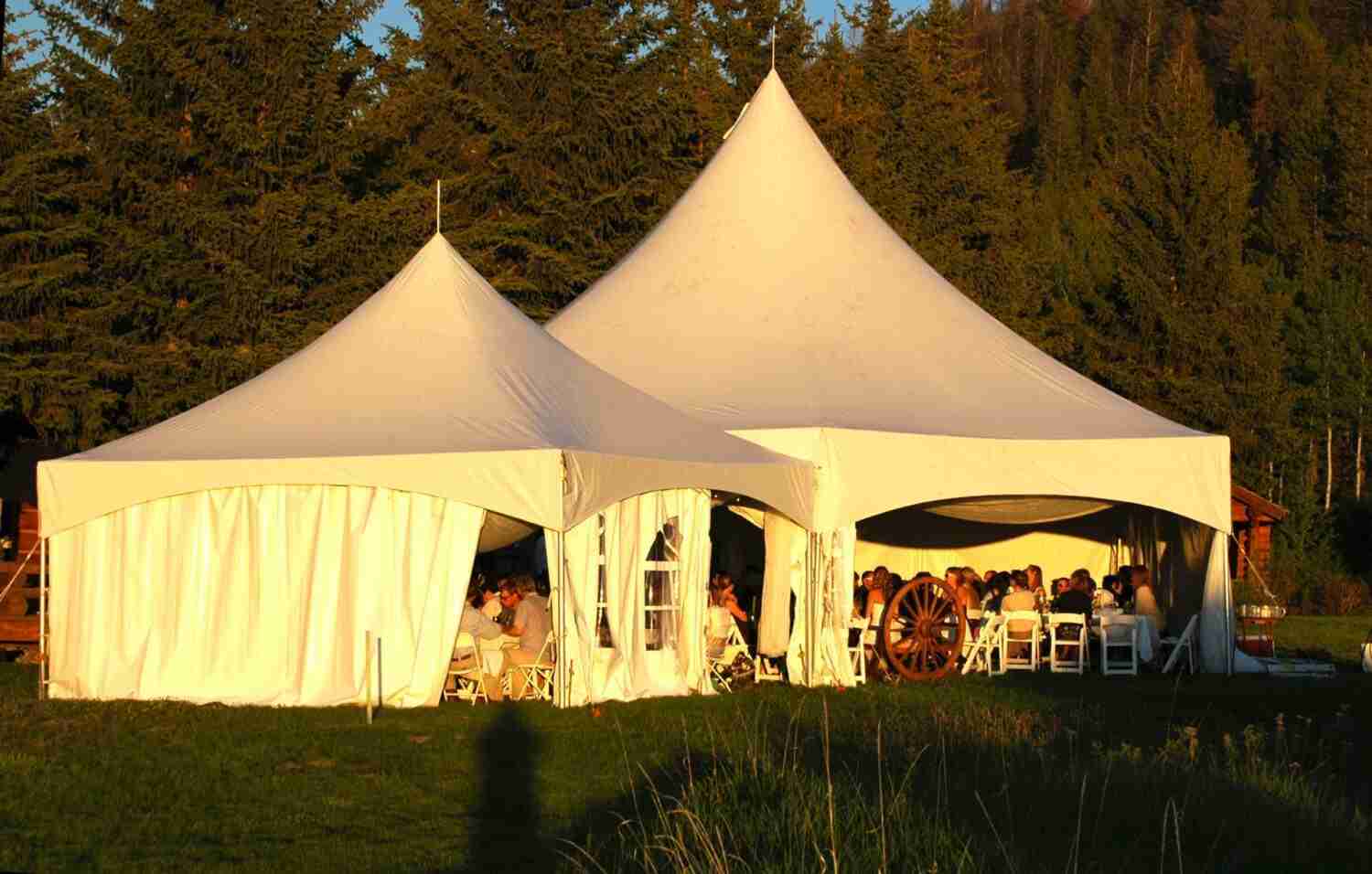 a wedding reception outside under tents