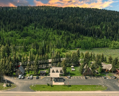 An aerial view of the Hatchet Resort with gift shop, cabins and trees